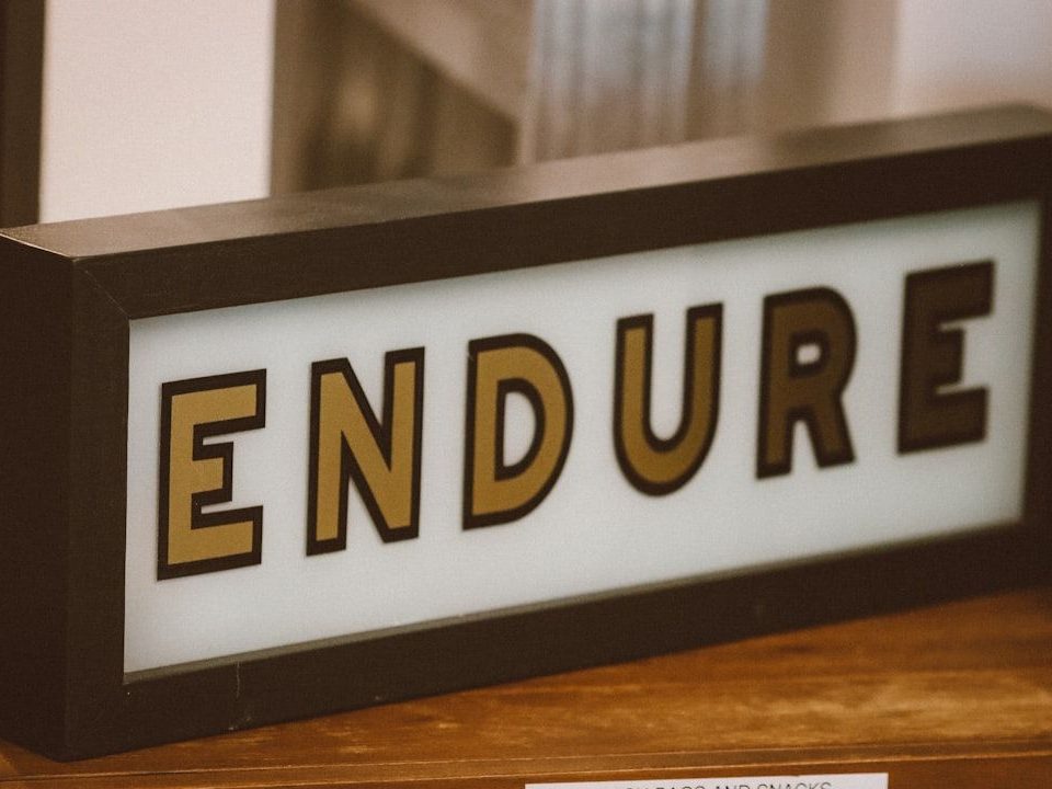 A sign that spells out the word endure, signifying Building Business Resilience.