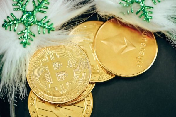 Infographic-style image featuring crypto coins a blockchain‑style icons—visually conveying the concept of calculating and reporting cryptocurrency profits and losses to Inland Revenue in Aotearoa New Zealand.